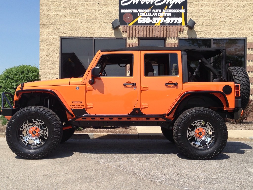 2013 Jeep wrangler with Fabtech 5 inch lift Moto Metal wheels wrapped in Ni...